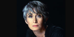 Headshot of Twyla Tharp against a black background