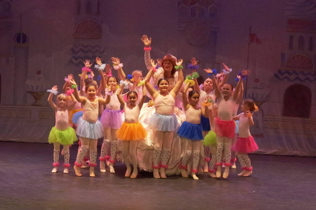 Mother Ginger in The Nutcracker surrounded by young children