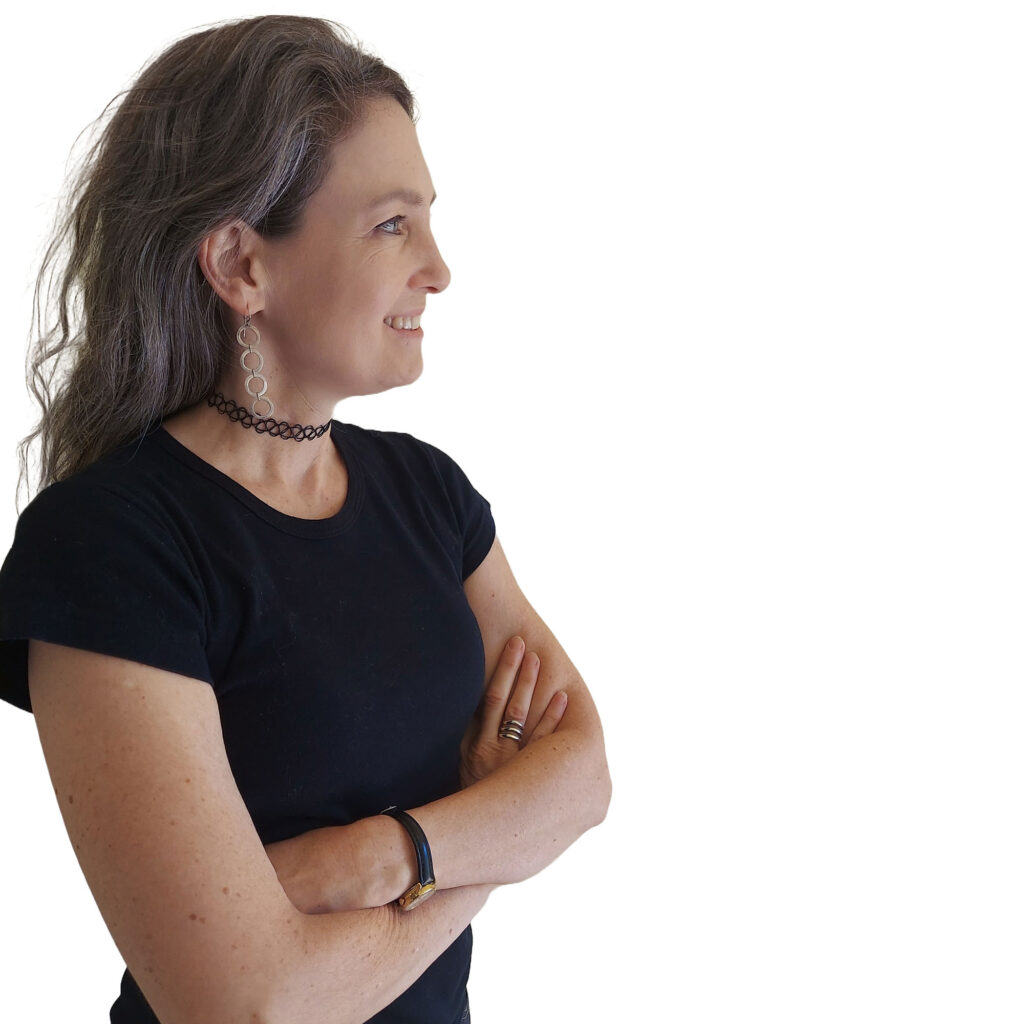Woman in black shirt stands with her arms crossed