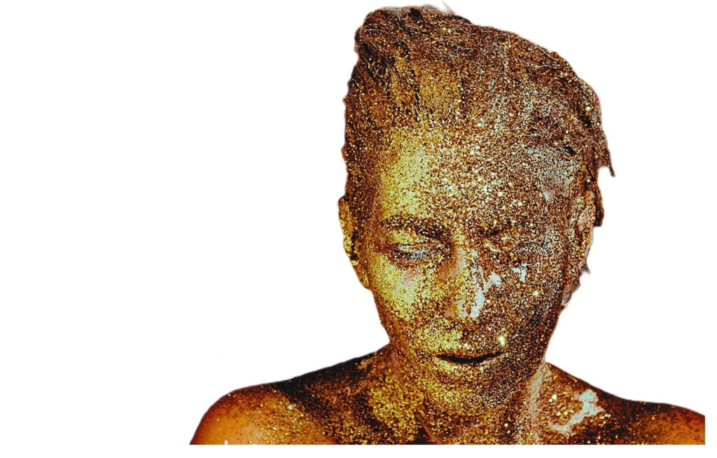 Woman's bust covered in sparkling gold