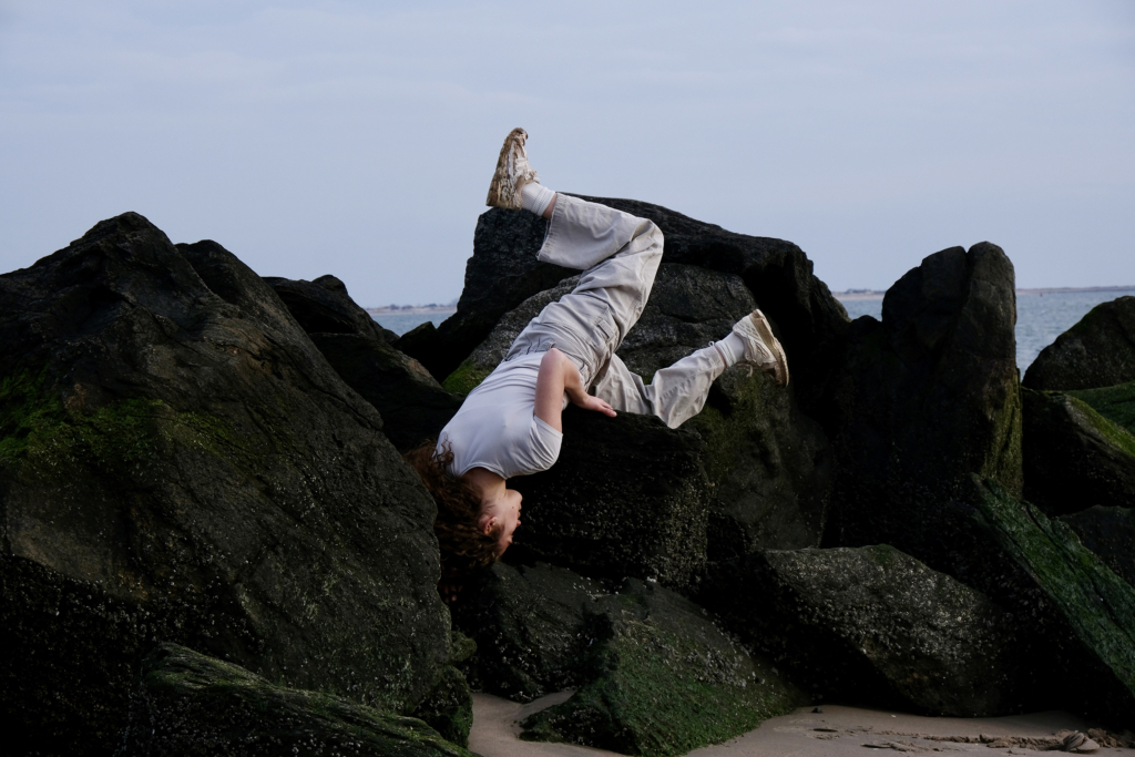 Dancer flips on rock