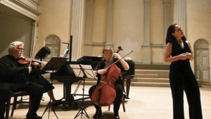 Violinist, pianist, cellist, and singer perform