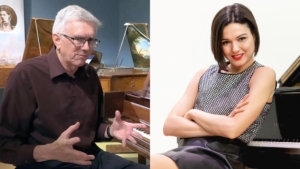 Man speaking in front of piano and woman seated in front of piano